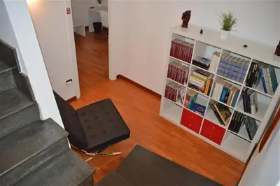 a room with a book shelf filled with books at B&B Porta delle Madonie in Campofelice di Roccella