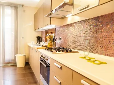 a kitchen with a stove and a counter top at Villa Lidia in Balestrate