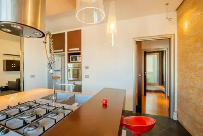 a kitchen with a stove and a counter top at Casamu' Management Apartment Palermo in Palermo