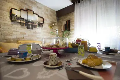 a table with plates of food on top of it at Dolce Conca D'Oro B&B in Palermo