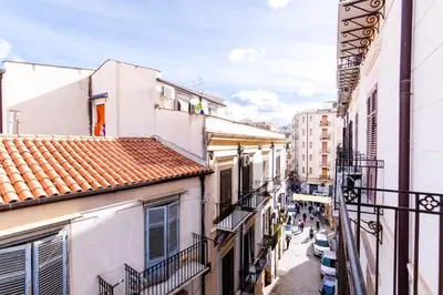 an alley in a city with buildings at Viola's Luxury House in Palermo