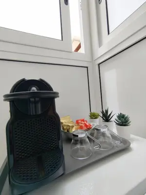 a small kitchen with a sink and a refrigerator at Notarbartolo Room#200 in Palermo