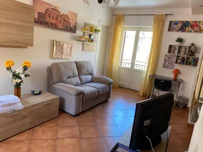 a living room with a couch and a television at La Cupola in Palermo