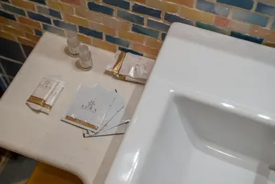 a white counter top with cards on top of it at A Casa del Gioielliere in Palermo