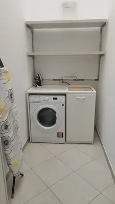 a washer and dryer in a small room at Vespucci Holiday in Casteldaccia