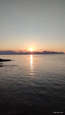 a sunset over a large body of water at Sea Sicily View in Bagheria