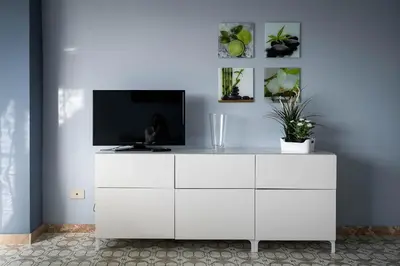 a white dresser with a television on top of it at Sea Sicily View in Bagheria