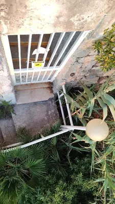 a room with a ceiling with a table and plants at Sea Sicily View in Bagheria