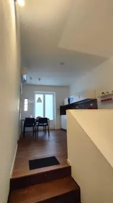 a room with a kitchen and a dining room at GIO&GIO central house in Palermo