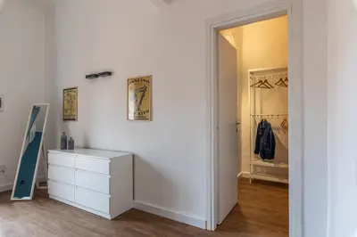 a white room with a dresser and a closet at Casa Valverde in Centro Storico by Wonderful Italy in Palermo