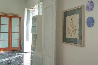 a room with a door and a picture on the wall at B&B da Nonna Cicci APT vicino al Teatro Massimo in Palermo