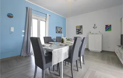 a dining room with a table and chairs at Awesome Home In Partinico With Wi-Fi in Partinico