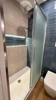 a shower with a glass door in a bathroom at Le Stanze del Re in Palermo