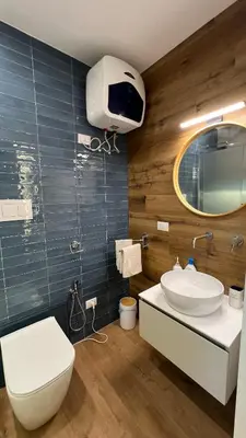 a bathroom with a toilet and a sink and a mirror at Le Stanze del Re in Palermo