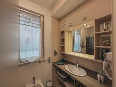 a bathroom with a sink and a mirror and a toilet at [jarase] nel centro di Palermo in Palermo