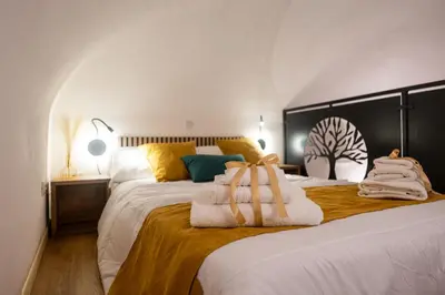 a bedroom with two beds with towels on them at Teama House - Appartamento in centro - Politeama in Palermo