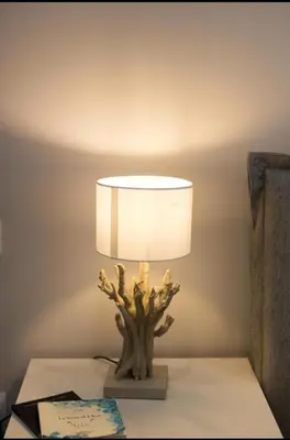 a lamp on a table in a room at Holiday hause Vite Aerea in Terrasini