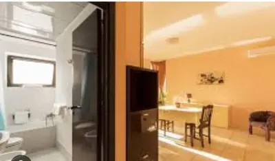 a room with a living room and a dining room at Cleotto residence case vacanza in Palermo