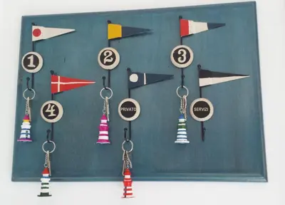 a group of key chains with arrows and numbers at Athena Bed & Breakfast in San Vito lo Capo