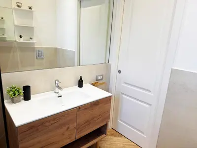 a kitchen with a sink and a microwave at Lucky Home Palermo in Palermo