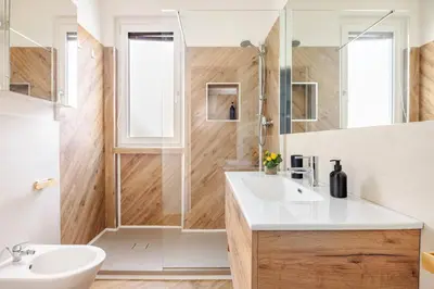 a bathroom with a toilet and a shower and a sink at Lucky Home Palermo in Palermo