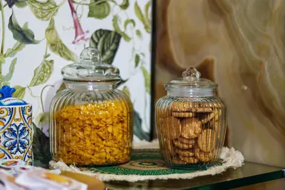 two glass jars filled with peanuts on a table at Alba e i Mori in Palermo