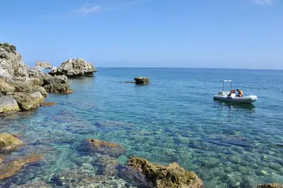 a group of people in a boat in the water at Villa La Fenice by Wonderful Italy in Castellammare del Golfo