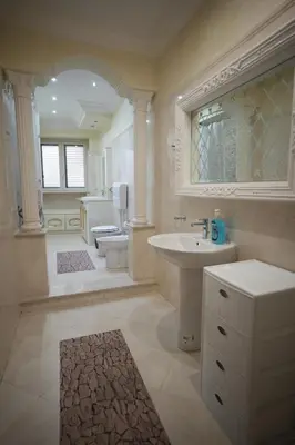 a large bathroom with a sink and a toilet at Casa Vacanze Madison Square in Palermo