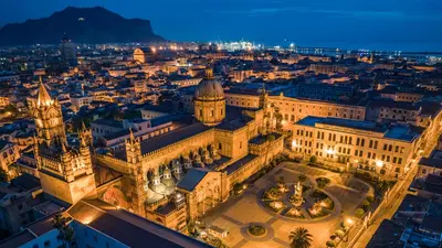 an aerial view of a city at night at Casa Vacanze Madison Square in Palermo