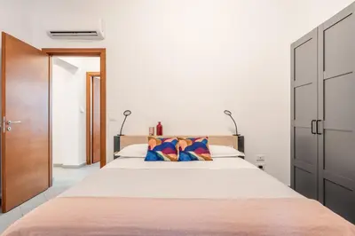a bedroom with a large bed with two pillows at Terrazza San Domenico in Palermo
