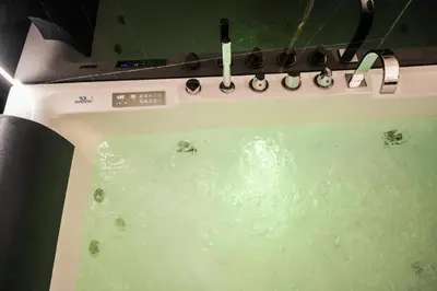 a stove top oven with green water in it at Superior Suite Palermo in Palermo