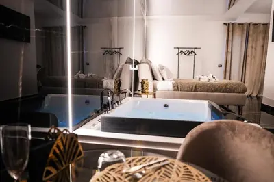 a bathroom with a bath tub and a mirror at Superior Suite Palermo in Palermo
