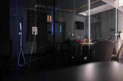a room with a table and a phone on the wall at Superior Suite Palermo in Palermo