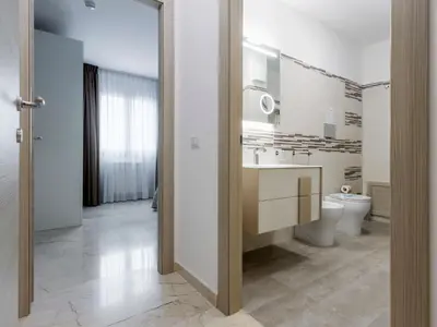 a bathroom with a toilet and a sink and a mirror at Apartment Sicilia by Interhome in Balestrate