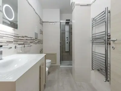a white bathroom with a sink and a toilet at Apartment Sicilia by Interhome in Balestrate