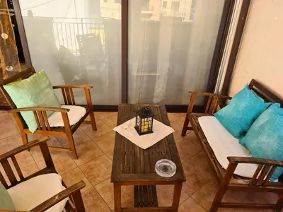 a living room with chairs and a coffee table at Holiday House Giorgia in Terrasini