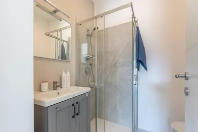 a bathroom with a sink and a shower at Villetta Hilda by Wonderful Italy in Mondello