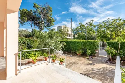 a balcony of a house with potted plants at Villetta Hilda by Wonderful Italy in Mondello