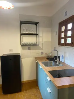 a kitchen with a sink and a counter top at Cortile Cascino Home in Palermo