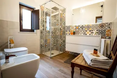 a bathroom with a tub and a shower and a sink at La Terrazza Sullo Spasimo in Palermo