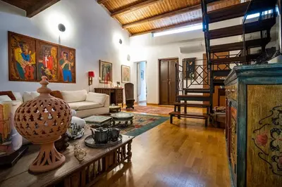 a living room with a couch and a table at La Terrazza Sullo Spasimo in Palermo
