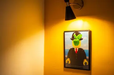 a room with a bed with a yellow wall at LEGO36 Apartment in Palermo