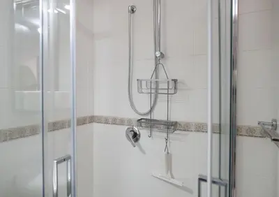 a shower in a bathroom with a glass door at Casa Doriana in Palermo