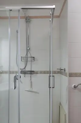 a shower with a glass door in a bathroom at Casa Doriana in Palermo