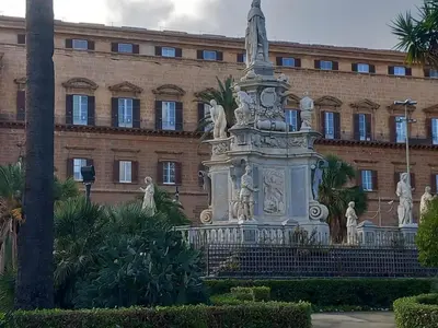 a statue in front of a building at Casa Doriana in Palermo