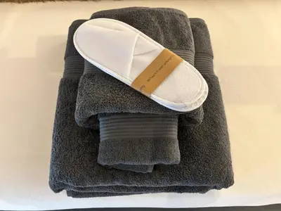 a shoe sitting on top of a pile of towels at Olivuzza 27 in Palermo