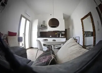 a living room with a couch and a table at Appartamento nel centro storico di Palermo in Palermo