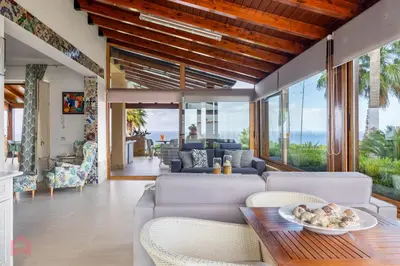 a living room with a couch and a table at Villa vista mare e piscina privata ad Alcamo in Alcamo