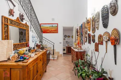 a room with a counter with many items on the wall at Villa vista mare e piscina privata ad Alcamo in Alcamo