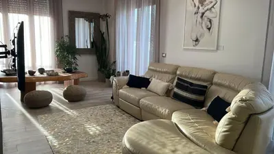 a living room with a couch and a table at Dimora D'aumale in Palermo